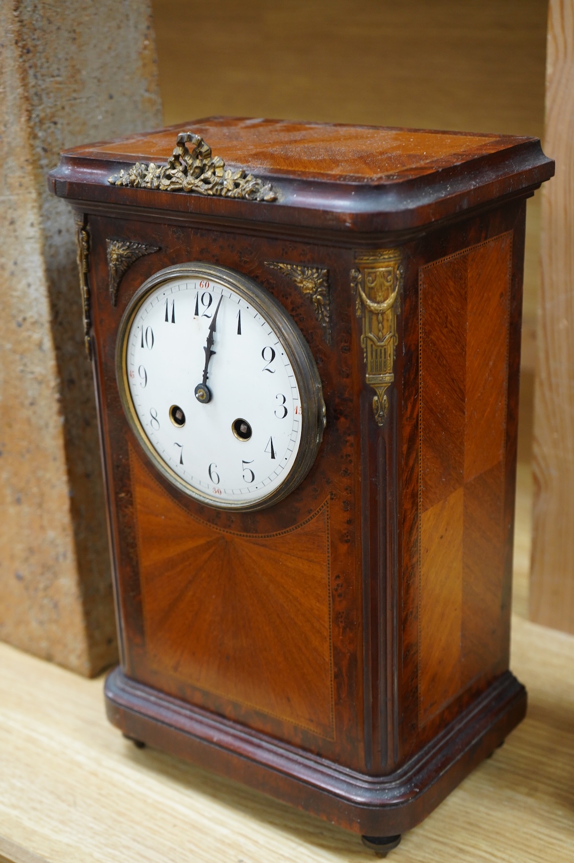 A 19th century oval brass carriage clock, striking on a bell, together with a mahogany and burr yew mantel clock, striking on a coiled gong, gong missing, largest 34cm high